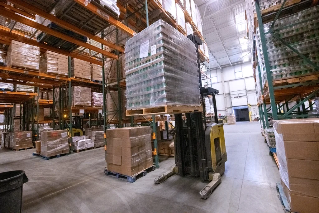 Warehouse operator moving pallets, the supply chain an SAP core runs