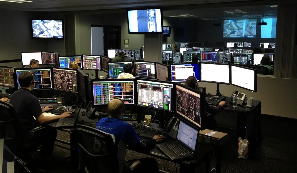 IT operations centre with engineers monitoring live services